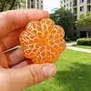 Hand-carved orange shape from pure natural jade - a collectible item