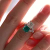 18K White Gold Asscher Cut Lab Emerald & Lab Diamond Toi et Moi Side-stone Cocktail Ring