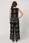 Back view of women's sleeveless printed co-ord set showing relaxed fit and border print detail