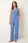 Front view of women's sky blue tailored vest set featuring V-neck button-up top and wide-leg pants