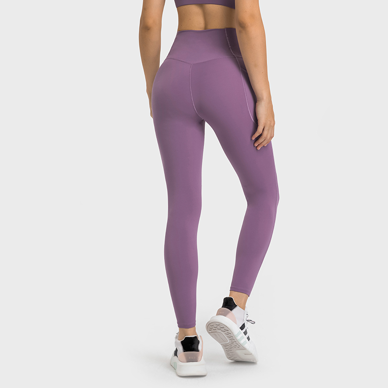 Buy Hergymclothing Saffron Purple no front seam high waist criss cross capri leggings with side pockets at an affordable price