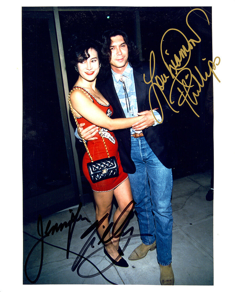 JENNIFER TILLY & LOU DIAMOND PHILLIPS GOLD SIGNATURE. SIGNED 8X10