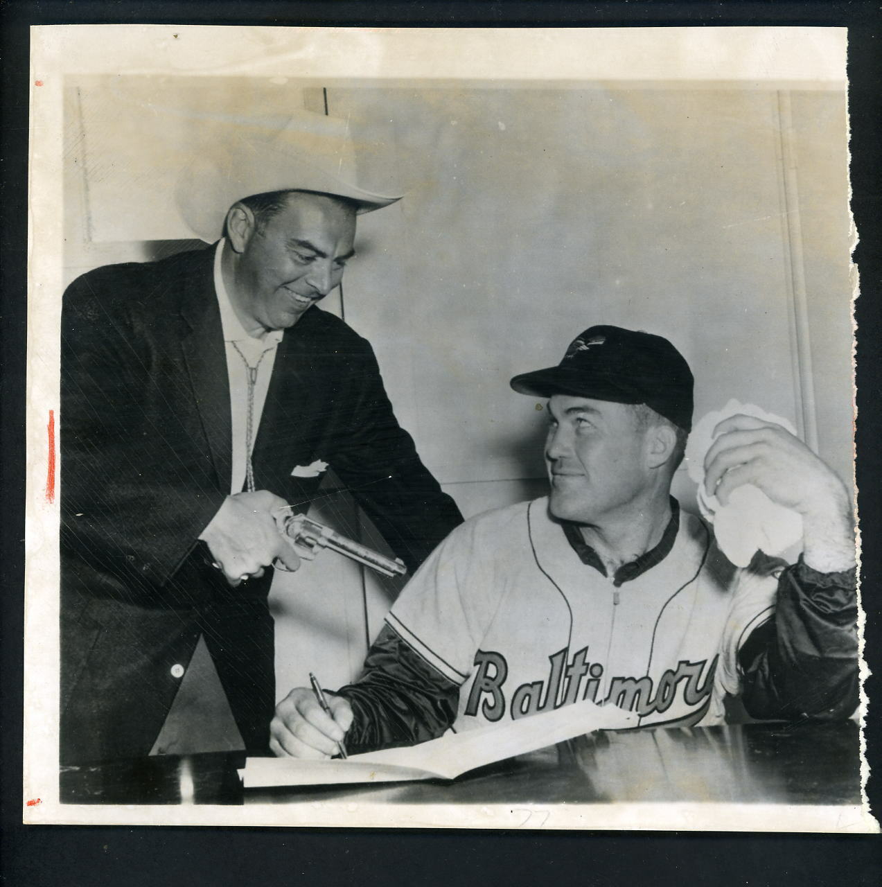 Baltimore Orioles Ast GM Jack Dunn holds gun Dave Philley 1956 image Press Photo Poster painting