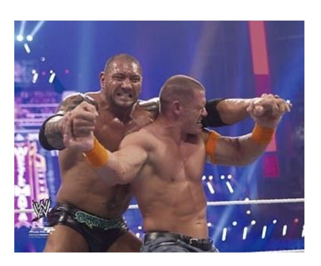 WWE JOHN CENA AND BATISTA OFFICIAL LICENSED 8X10 WRESTLING Photo Poster paintingFILE Photo Poster painting