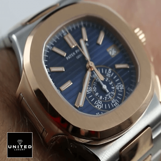 Patek Philippe Nautilus Blue Dial Gold Bezel Replica on the man wrist