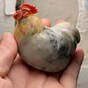 A plump, round rooster hand-carved from natural Shoushan stone, showcasing the natural colors and textures of the stone