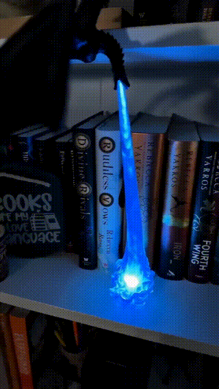 Fire breathing dragon display light with glowing flame effect