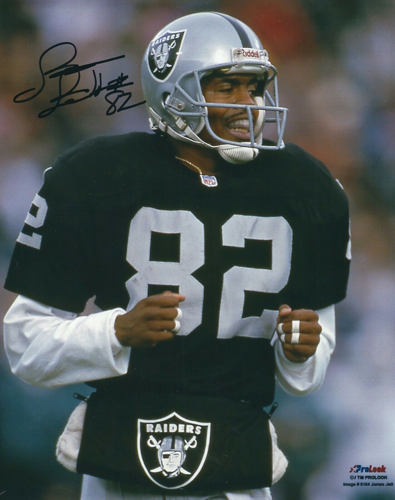 Autographed JAMES JETT Oakland Raiders 8x10 Photo Poster painting w/COA