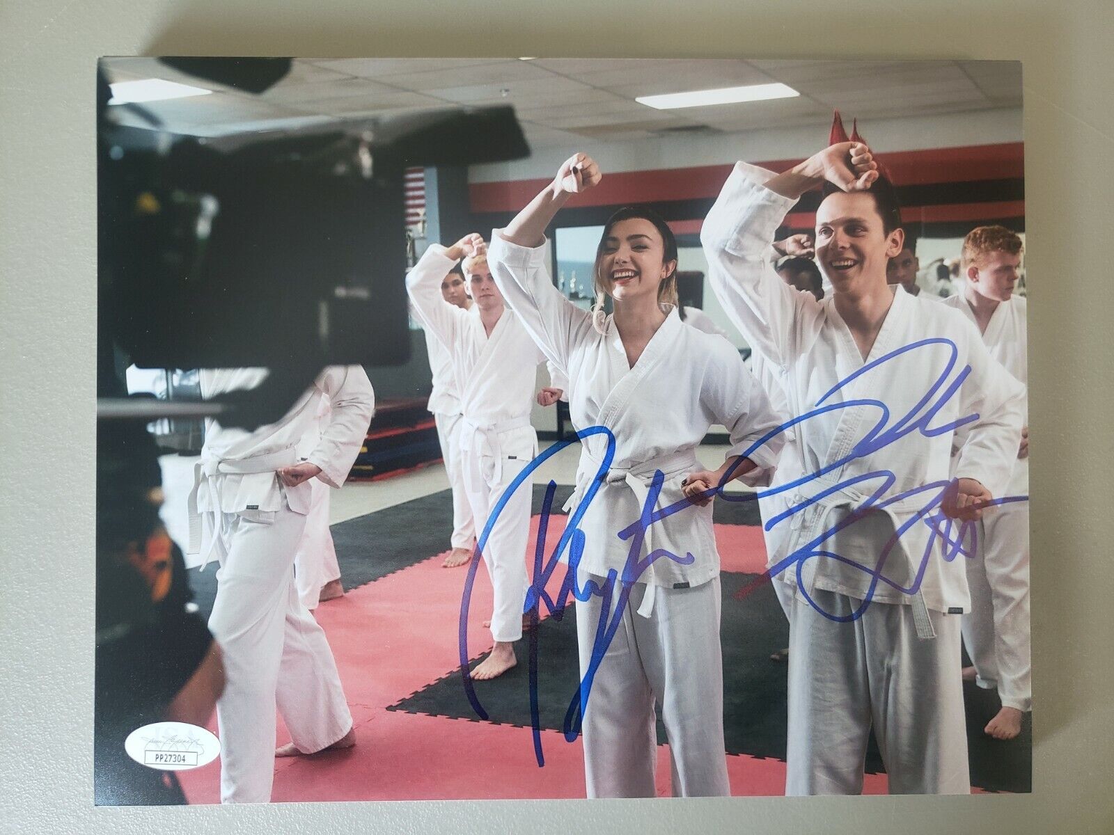 8X10 Autographed by Jacob Bertrand and Peyton List in Cobra Kai Season 3. JSA