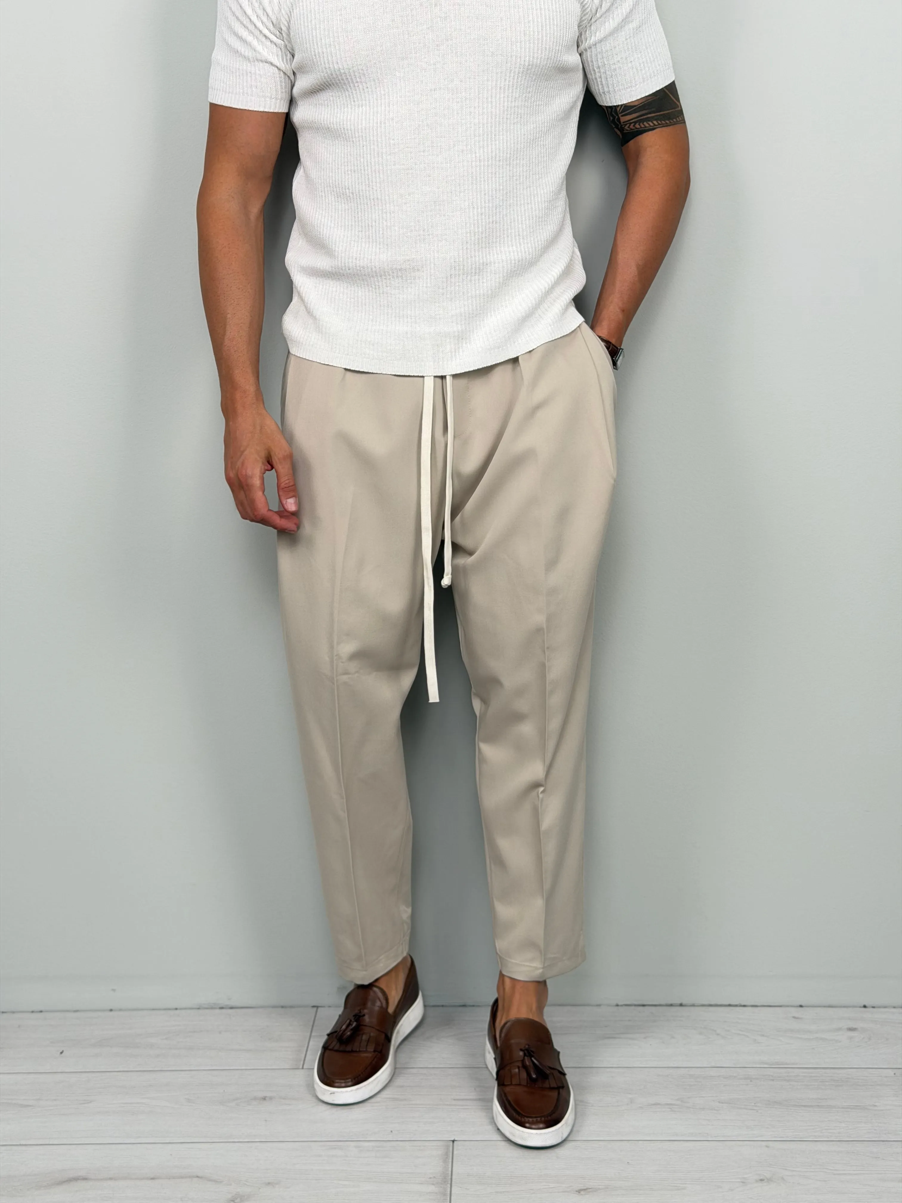 Japan Follow tapered drawstring pants in a neutral tone