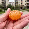 Hand-carved orange shape from pure natural jade - a collectible item