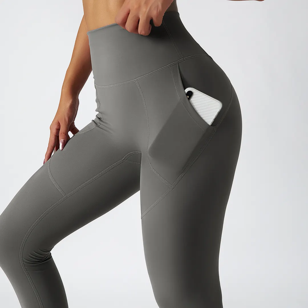 Shop Moonstone Gray renewable fabric sustainable no front seam yoga leggings with side pockets online on Hergymclothing