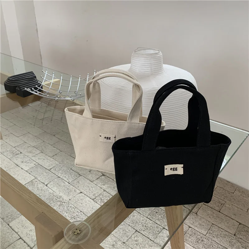 Mongw New Han Dai Same Style Egg Canvas Handbag Size Bento Bag Simple Leisure Portable Tote Bag