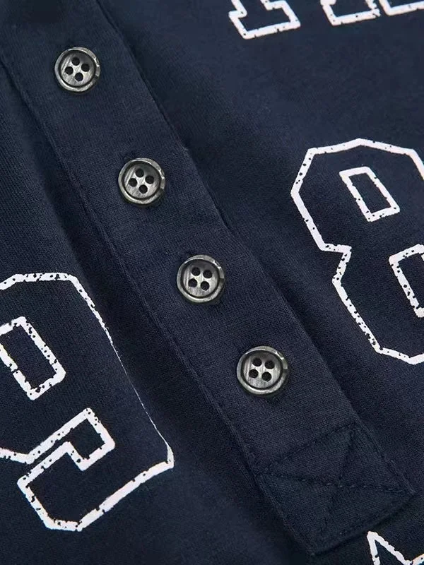 Brownm dark blue long sleeve top with letter logo