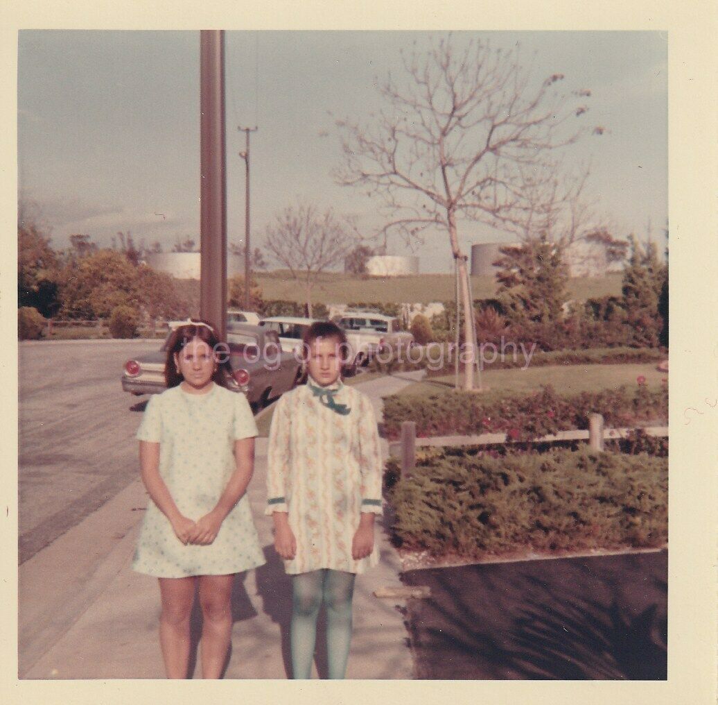 60's 70's Sidewalk Portrait Of Two Girls FOUND Photo Poster paintingGRAPH Color VINTAGE 97 12 A