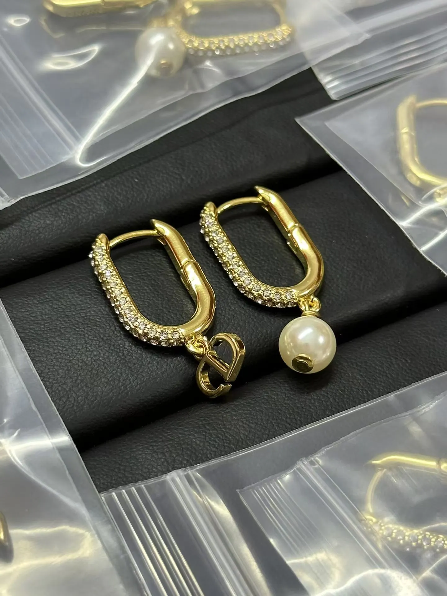 Dior Asymmetric Charms Hinged Earrings