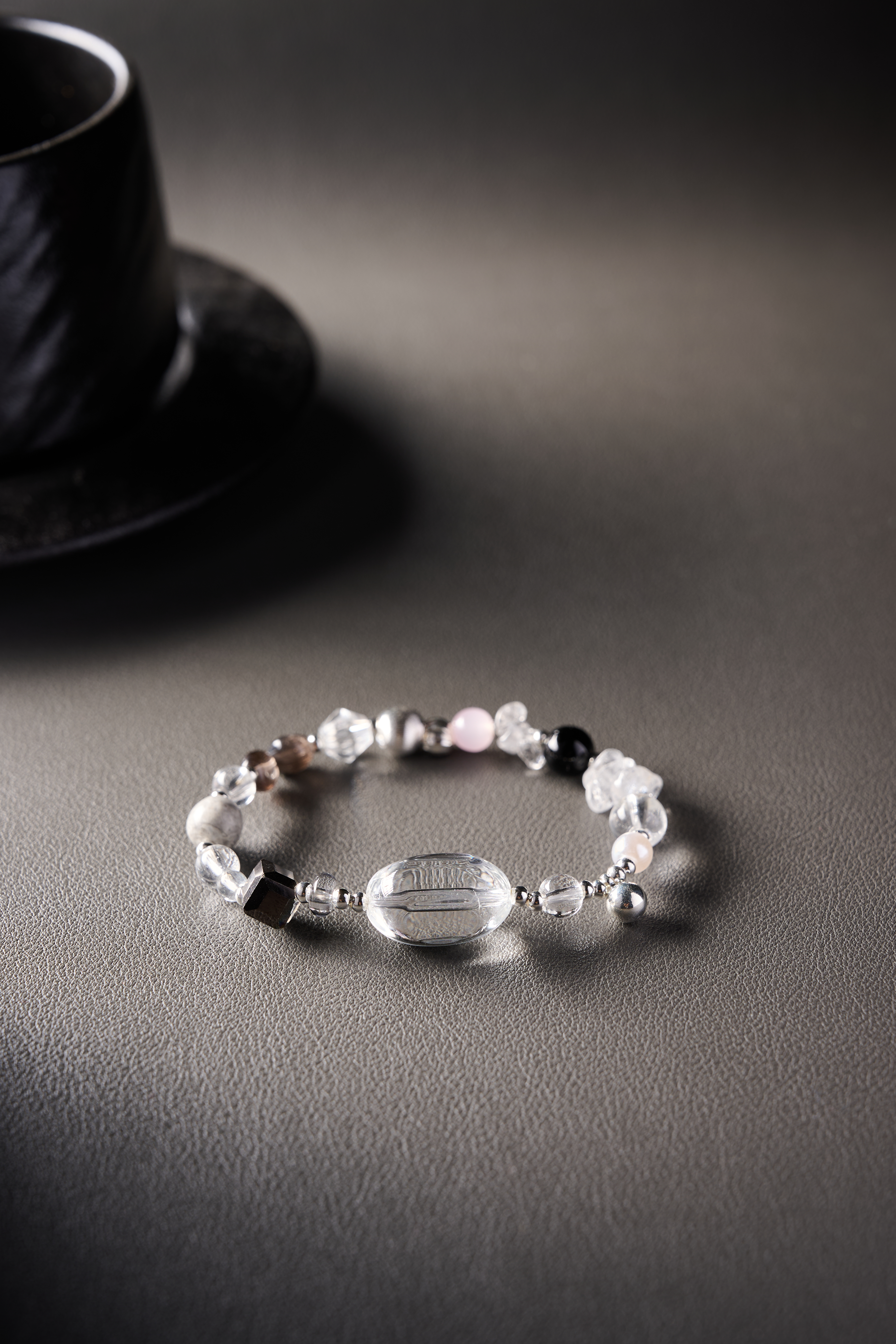 Detail shot – soft pink rose quartz beads with metallic accents.