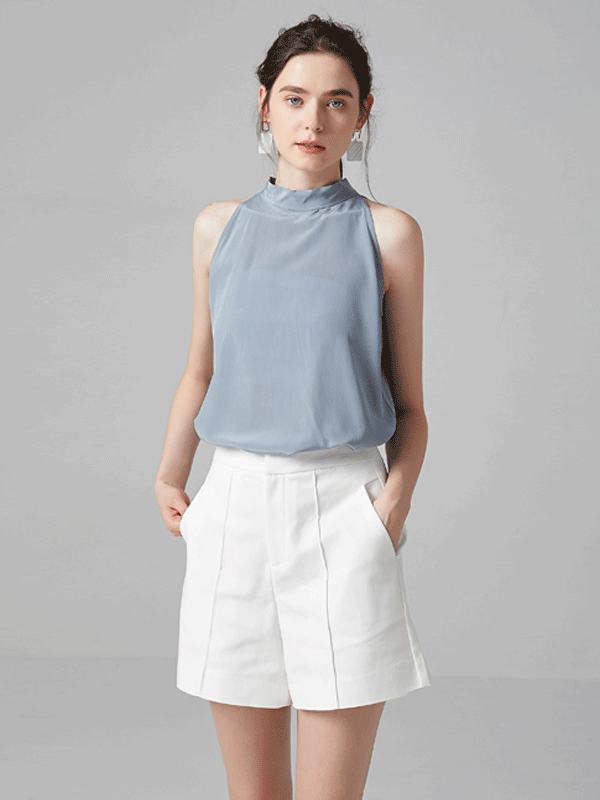 Blouse en soie bleu sans manches dos avec nœud 1