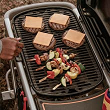 Food being grilled on Weber Traveler