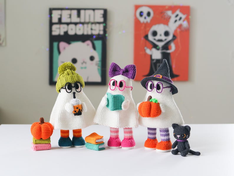 Handmade crochet ghost dolls in Halloween costumes with accessories – witch hat, bow, pumpkin, boba tea, books, and black cat – perfect spooky decor for fall or Halloween gifting, Amigurumi PDF pattern