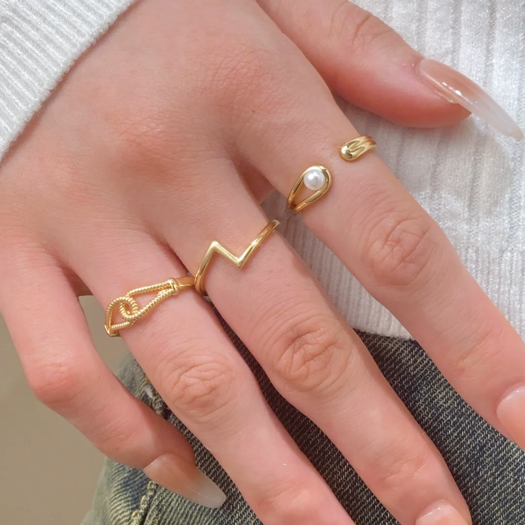 Geometric twisted pearl gold plated ring