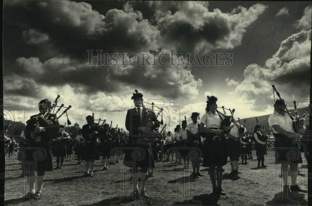 Press Photo Poster painting Bagpipers play at the District Games - tua15171