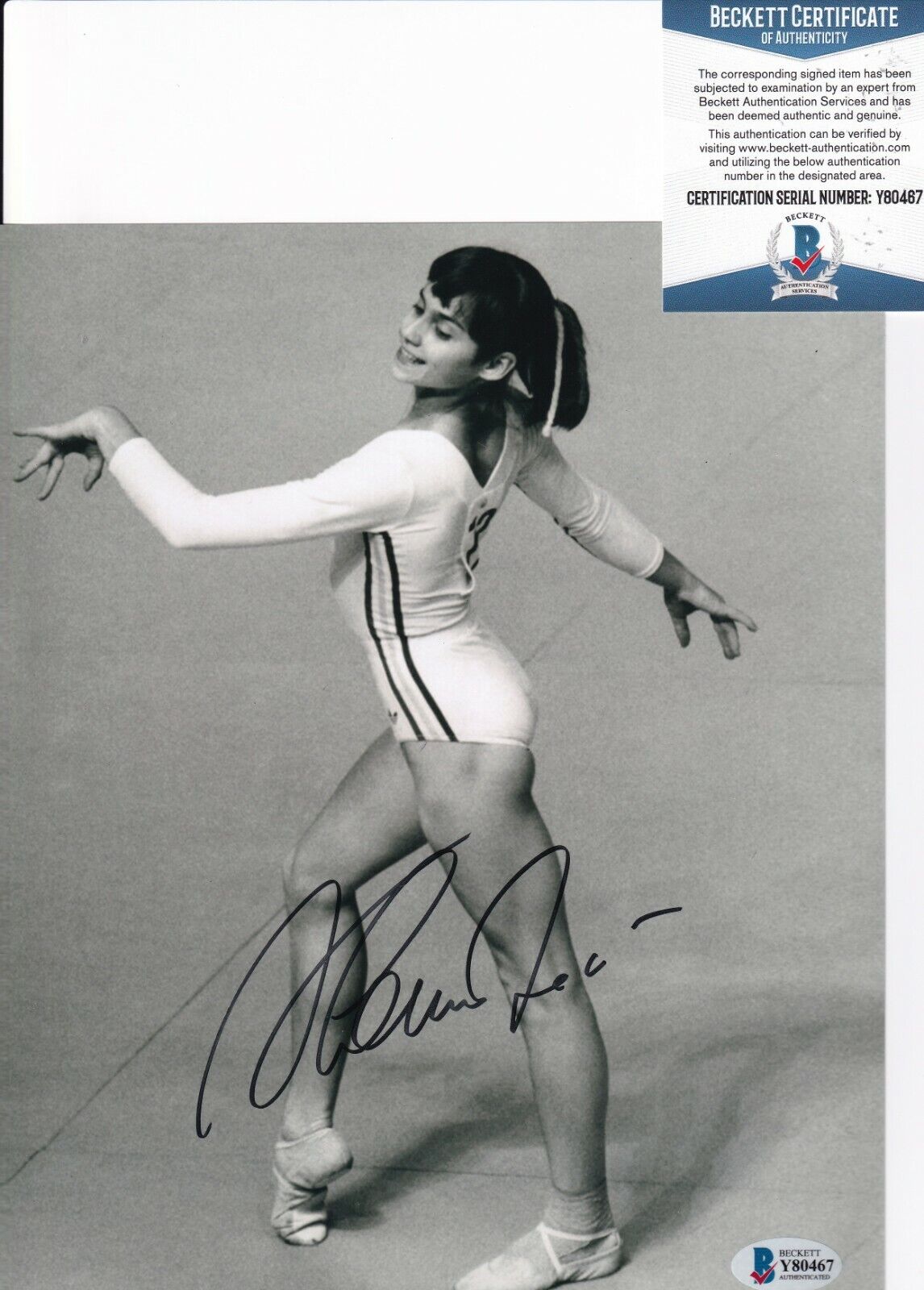 NADIA COMANECI signed (GYMNASTICS GOLD MEDALIST) 8X10 Photo Poster painting BECKETT BAS Y80467