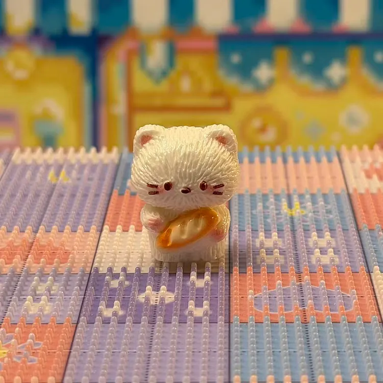 White cat holding a bread Resin Charm