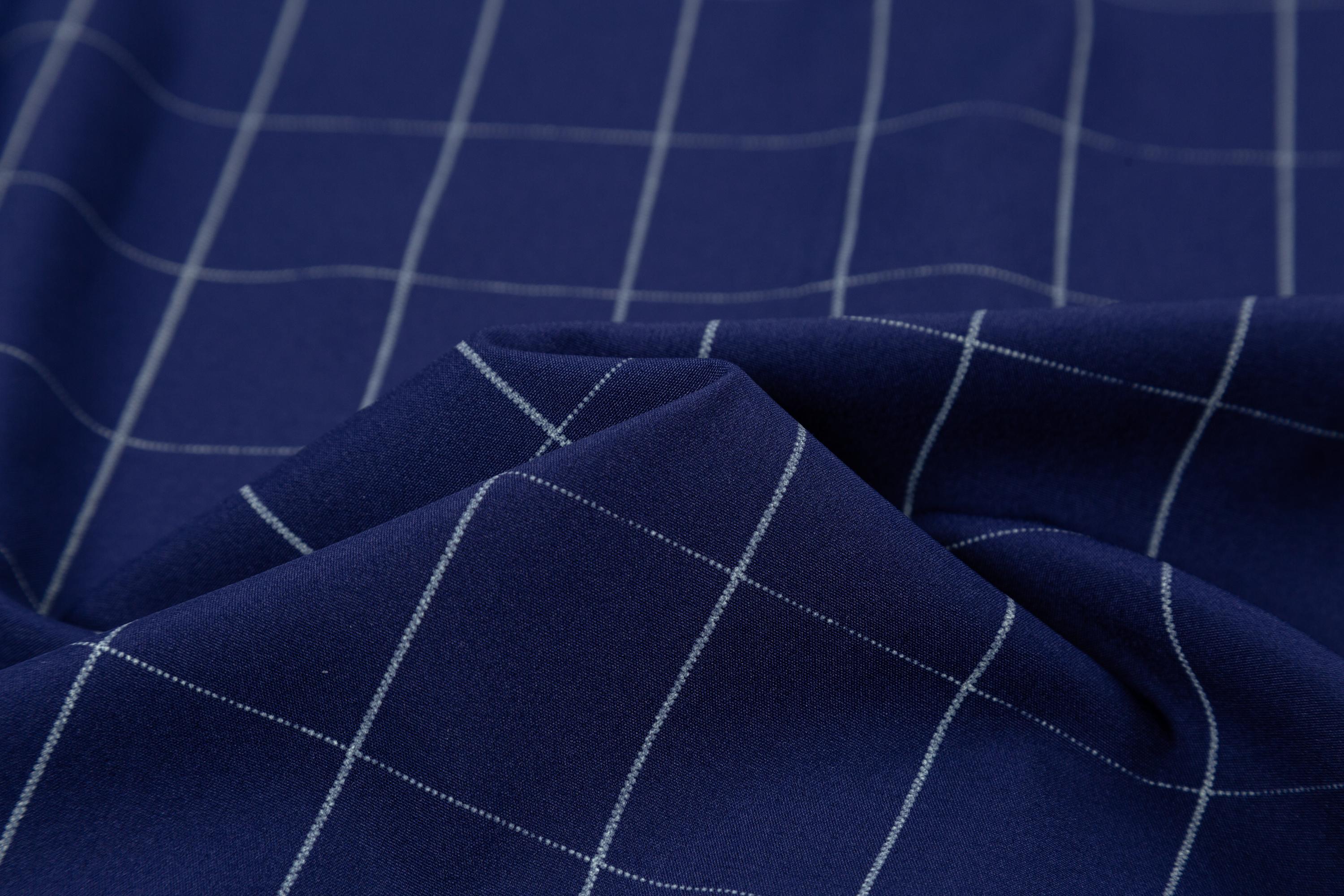 Two men’s long-sleeve shirts with a plaid color-block design, styled for business casual wear. Featuring a notched lapel collar that is sharp and well-structured, red buttons add a refined touch, and the blue-and-white plaid interior creates visual depth.