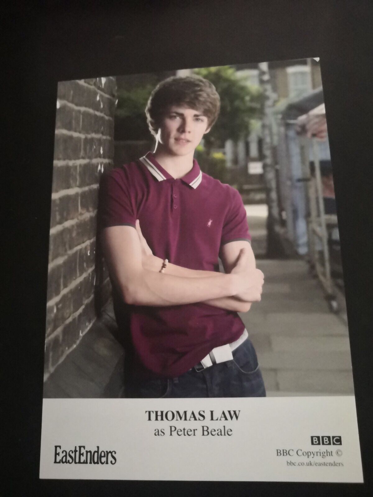 EASTENDERS UNSIGNED CAST CARD OF THOMAS LAW