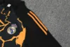 Real Madrid 25-26 1/4 Zip Tracksuit Black & Orange Camouflage Style Chandal