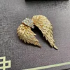 Golden Angel Wing Brooch with Rhinestone Accent TT Design&trade;