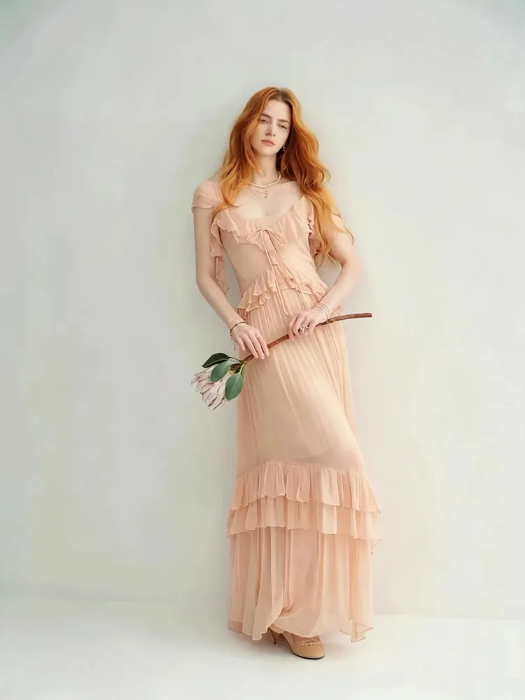 Nude-colored off-shoulder light dress