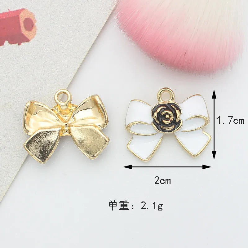 10 PCS/Package 1.5 * 20mm 14 * 14mm 7 * 12mm Alloy Rhinestones Pearl Number Heart Shape Bow Knot Polished Pendant