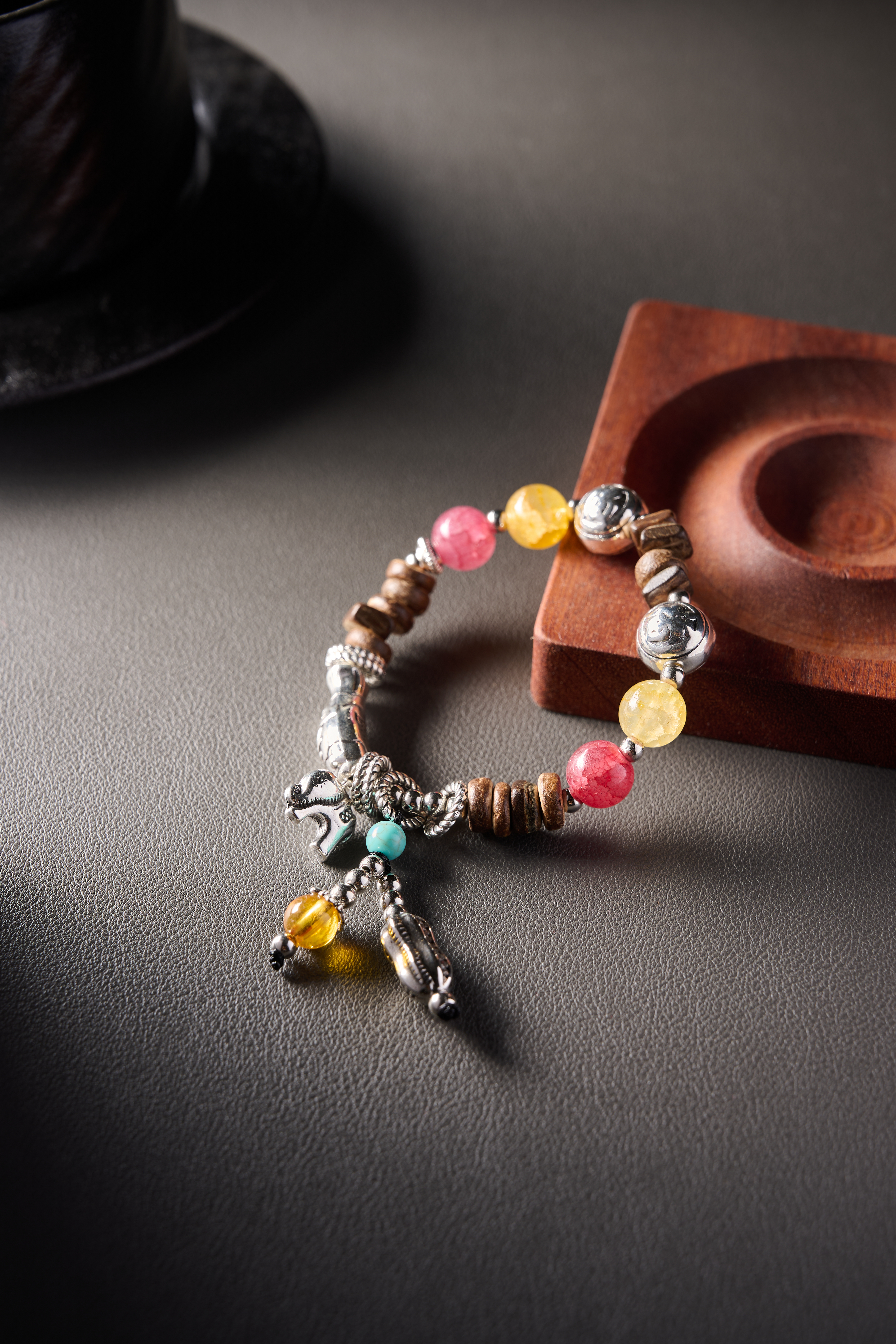 Stone highlight – translucent yellow stone next to pink stone, glossy surface and vivid color.