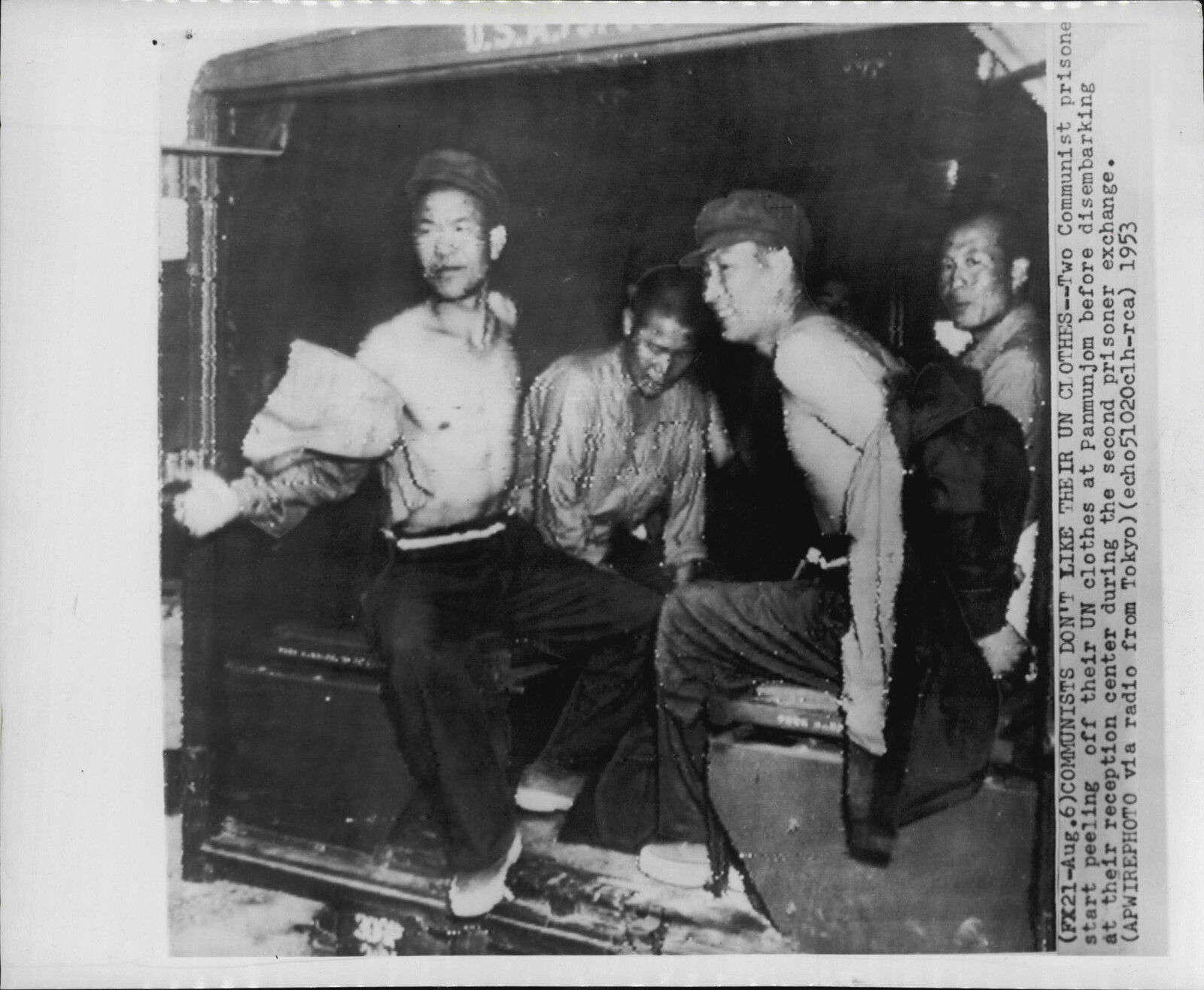 Communist Prisoners Strip UN Clothing at Panmunjom 1953 Korea War Press Photo Poster painting