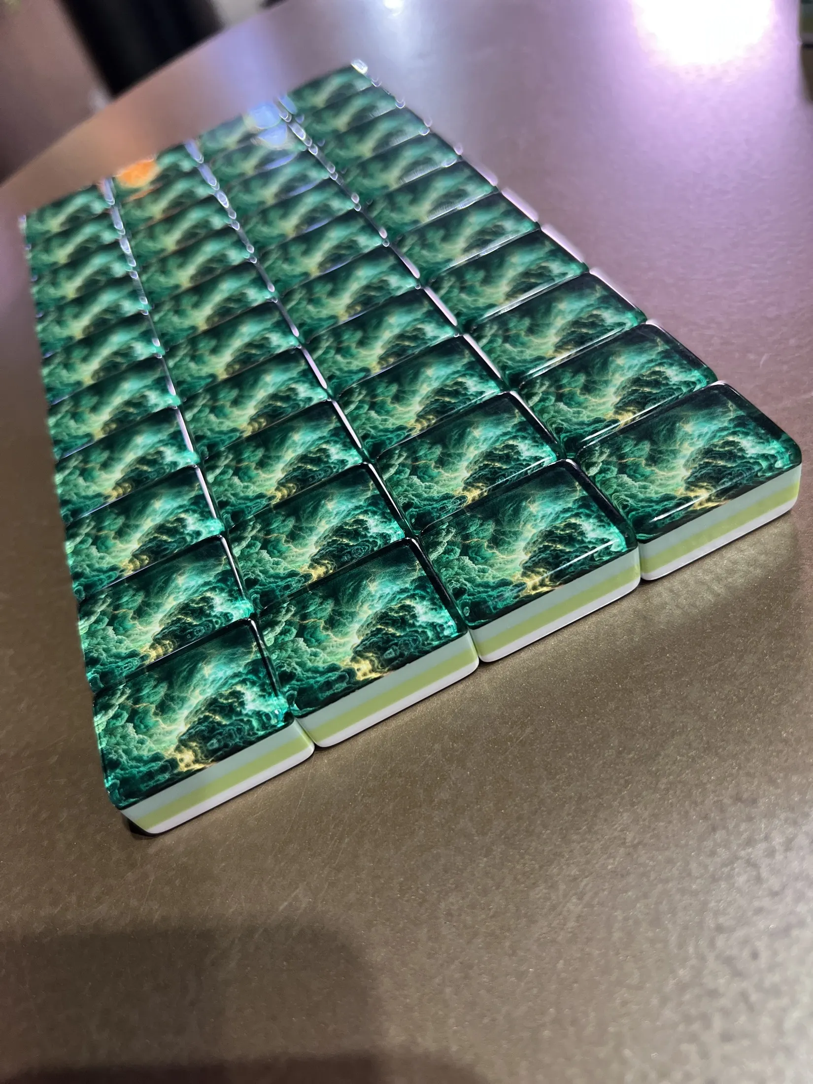 A close-up of the green cloud movement across polished backs.