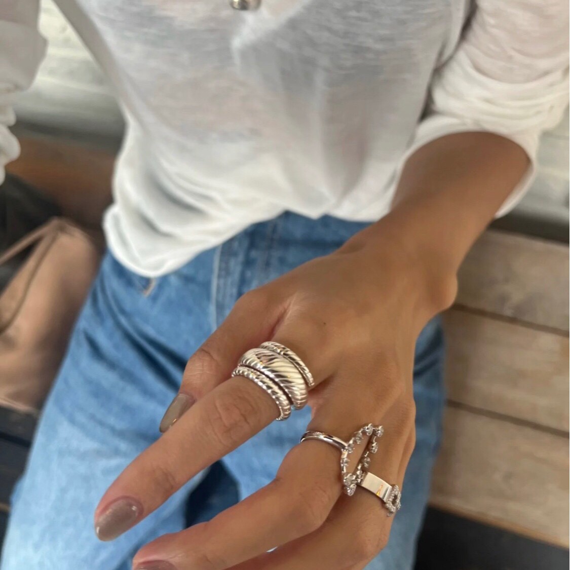 Close-up of S925 sterling silver wide ring with line details 