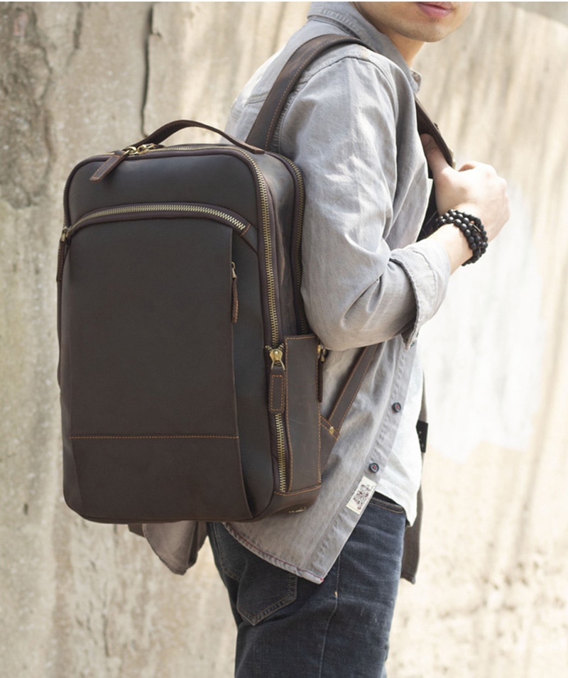 Outdoor Model Show of Woosir Leather Laptop Backpack with Trolley Sleeve and Double Compartments