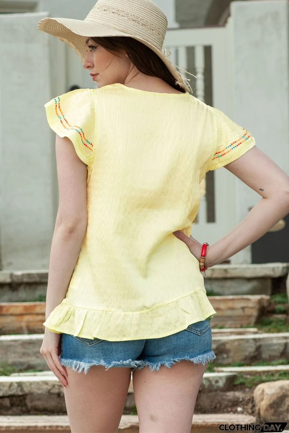 Embroidered V-Neck Ruffle Hem Top