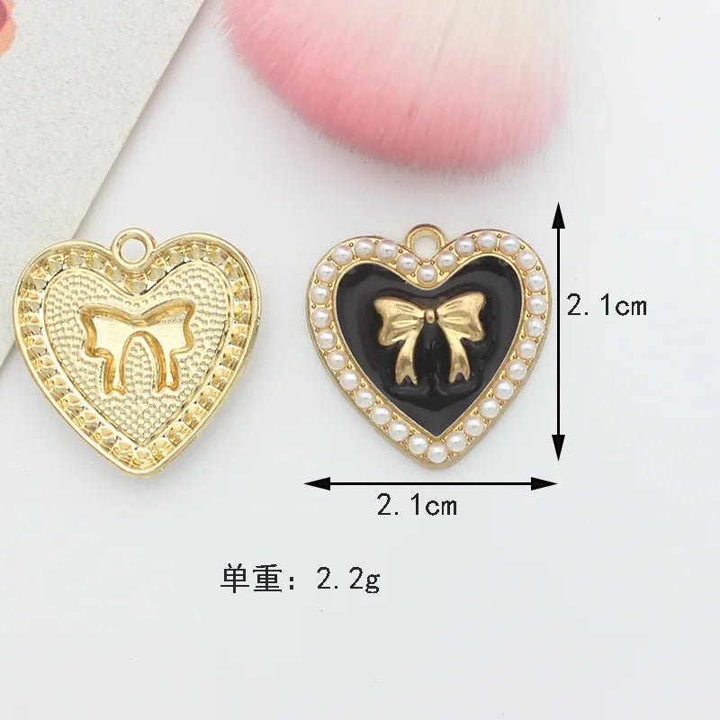 10 PCS/Package 1.5 * 20mm 14 * 14mm 7 * 12mm Alloy Rhinestones Pearl Number Heart Shape Bow Knot Polished Pendant