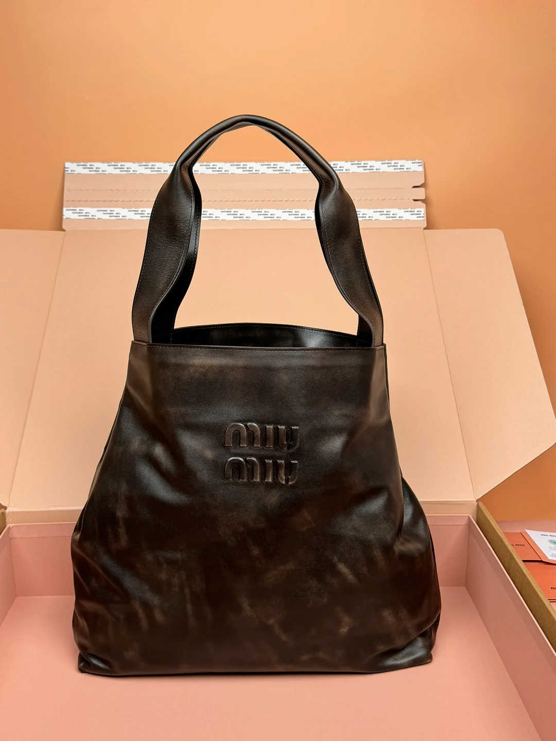 miumiu hobo shoulder bag with dual straps