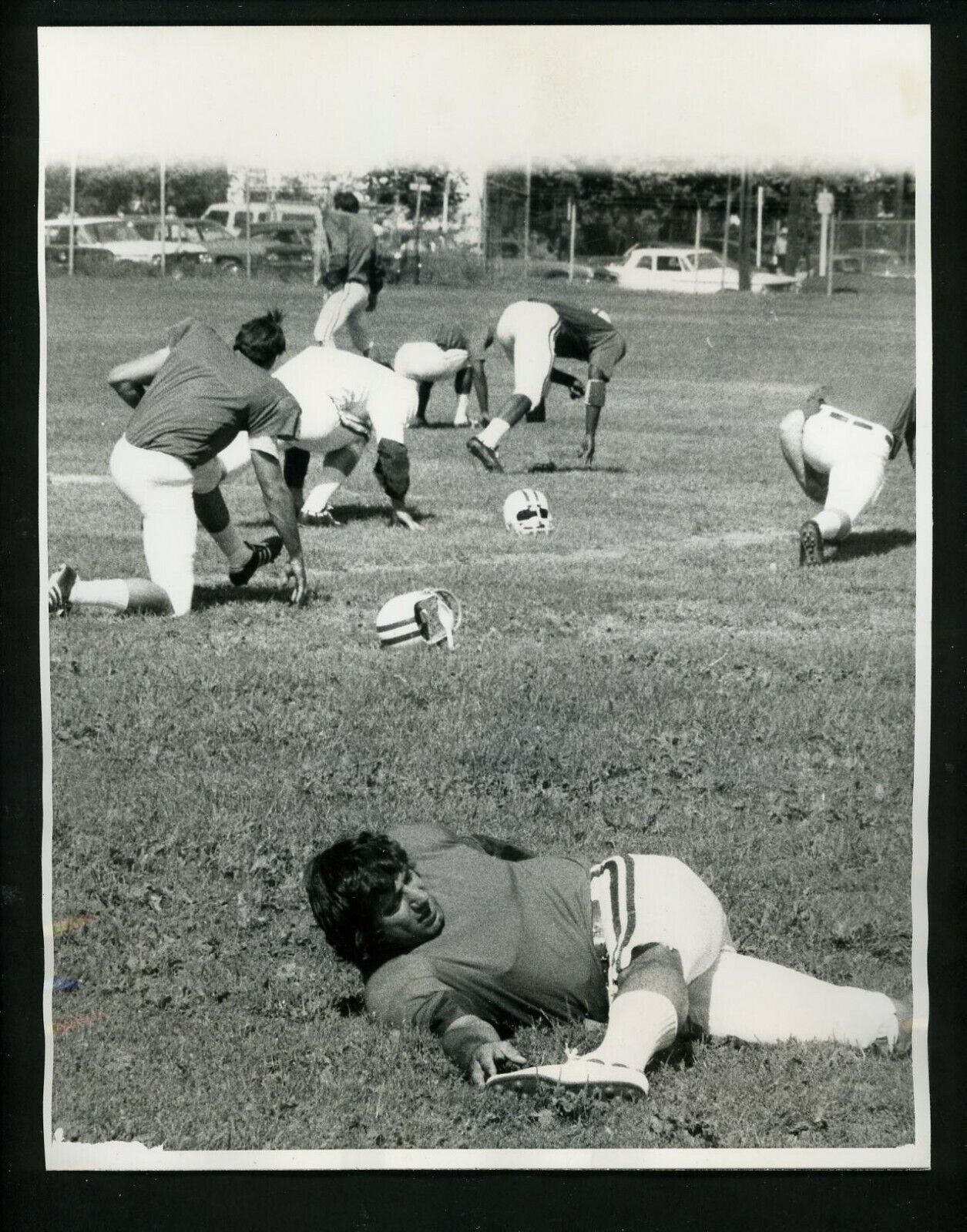 Joe Namath stretches during New York Jets traing camp 1970 Press Photo Poster painting