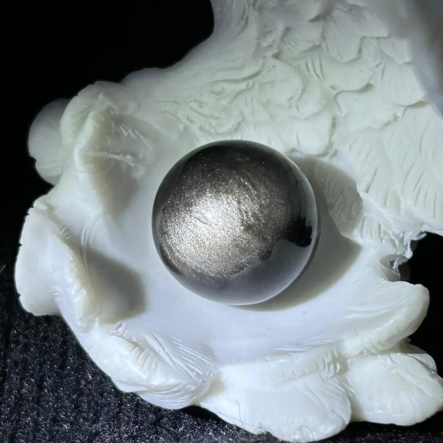 Silver sheen obsidian sphere in meditation corner