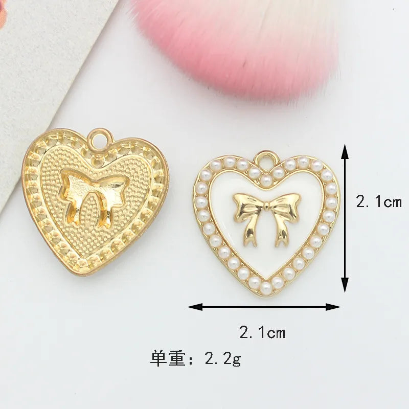 10 PCS/Package 1.5 * 20mm 14 * 14mm 7 * 12mm Alloy Rhinestones Pearl Number Heart Shape Bow Knot Polished Pendant