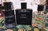 Um conjunto de perfume masculino de tr&ecirc;s pe&ccedil;as