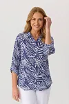 Front view of elegant geometric print shirt with roll-tab sleeves for mature women