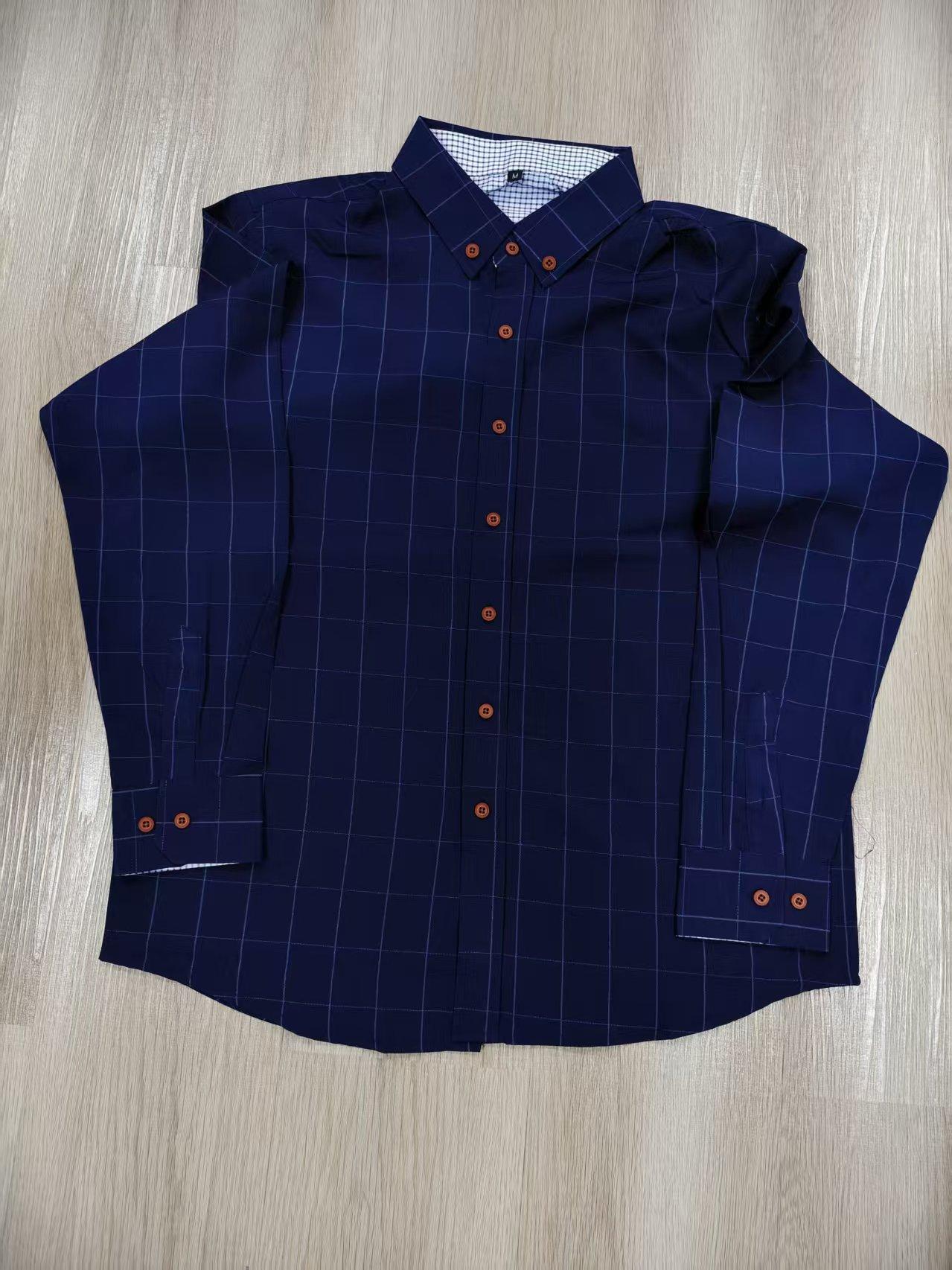 Two men’s long-sleeve shirts with a plaid color-block design, styled for business casual wear. Featuring a notched lapel collar that is sharp and well-structured, red buttons add a refined touch, and the blue-and-white plaid interior creates visual depth.