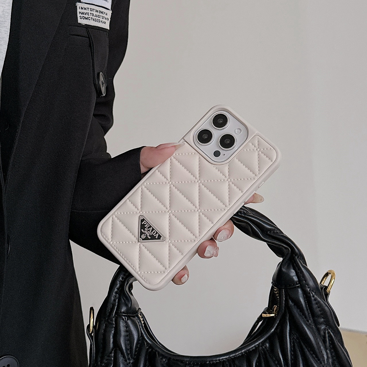 Prada Elegant Metal Monogram Diamond-Quilted Lambskim Leather Apple iPhone Case