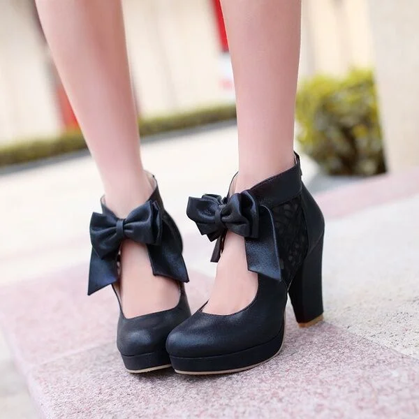 Chaussures à talons épais avec nœuds noirs à bout rond Flusfy